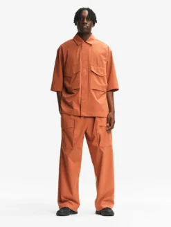 Le pantalon mixte ample Aigle Experience by Études - Orange
