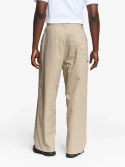 Le pantalon mixte ample Aigle Experience by Études - Beige