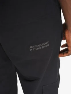 Le pantalon mixte multipoches Aigle Experience by Études - Noir