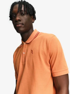 Polo Dry Fast™ à col rabattu avec logo sur la poitrine - Orange